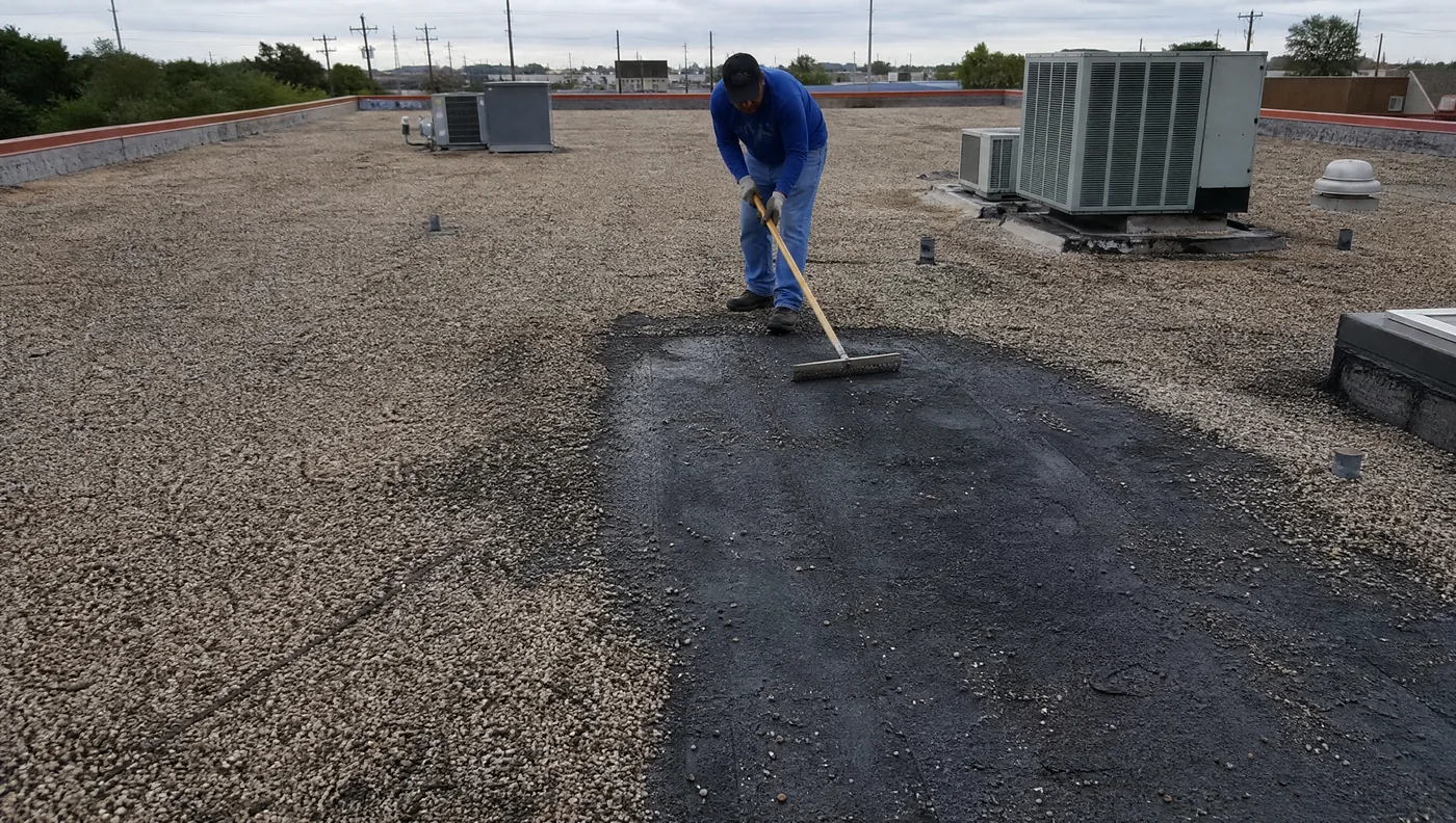 Gravel-surfaced built-up roof on a Houston commercial building
